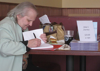 Anna Renault signing books